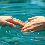 Serene hands gently touching peaceful flowing water representing healing touch and therapeutic release, soft natural lighting, calming blue tones, no text no words no letters