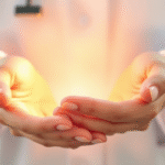 Soft pastel healing hands cradling gentle light representing medical care and comfort with warm peaceful atmosphere no text no words no letters