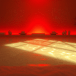 Soft glowing red light emanating warmth and healing energy in serene spa-like setting with gentle shadows, no text no words no letters