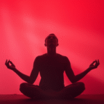 Peaceful person meditating in soft red and warm light rays, serene wellness concept, calming colors, no text no words no letters