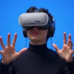 Person wearing VR headset in calming blue digital environment, relaxed posture, hands gesturing naturally, soft lighting, therapeutic atmosphere, no text visible