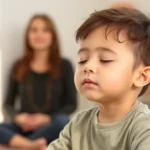 Child sitting peacefully with eyes closed during guided mindfulness meditation session, soft natural lighting in therapy room, calm composed facial expression, wearing comfortable clothing